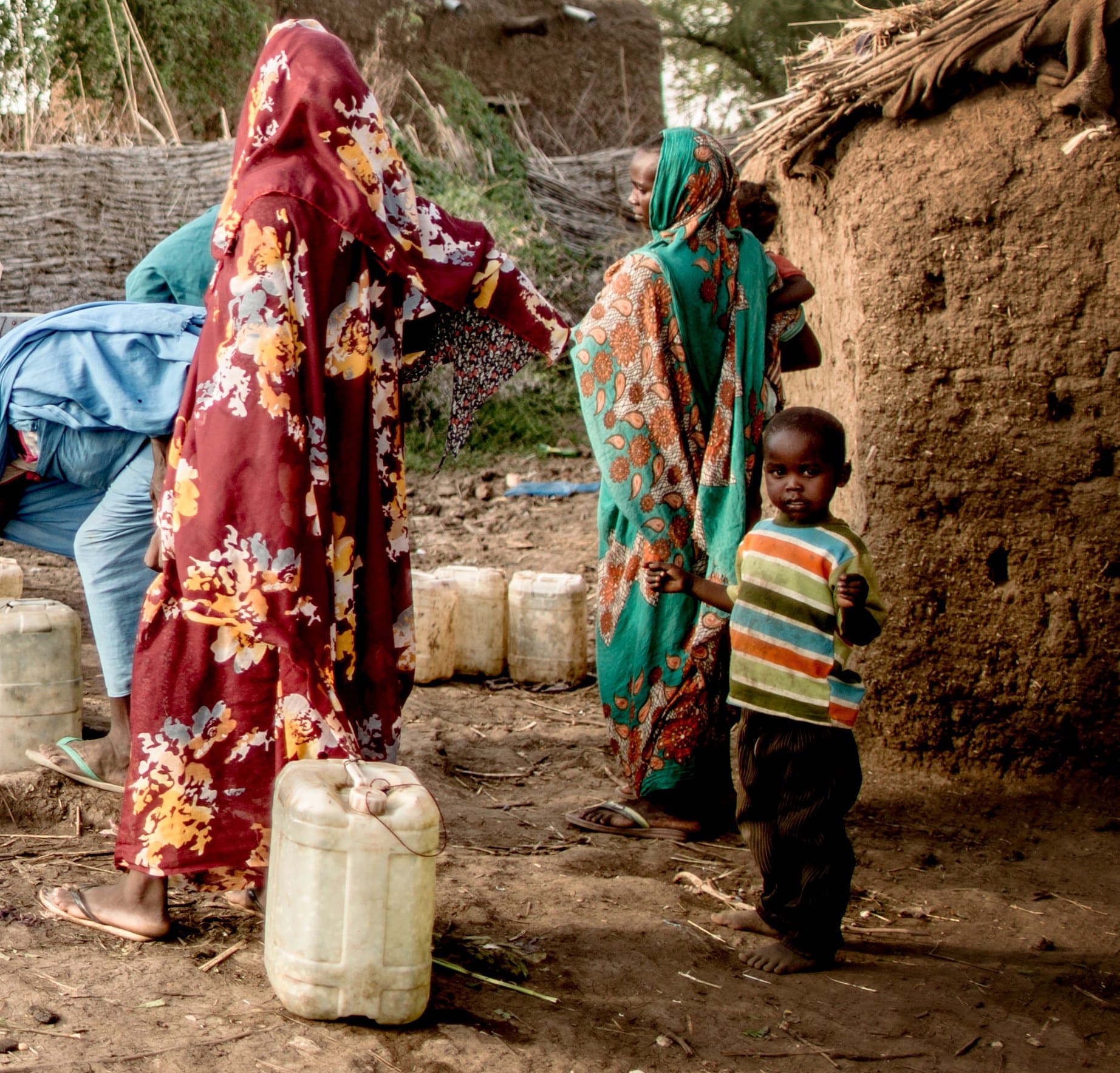 Women collecting water in jerry cans